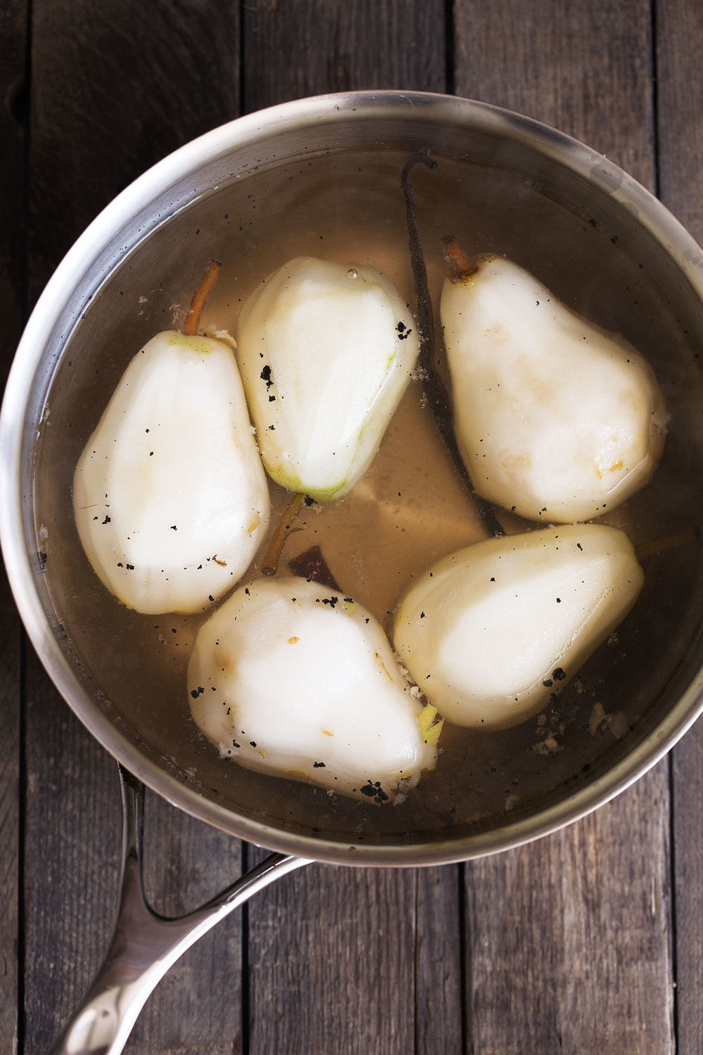 bosc pears poached in vanilla and cinnamon cooking with cocktail rings