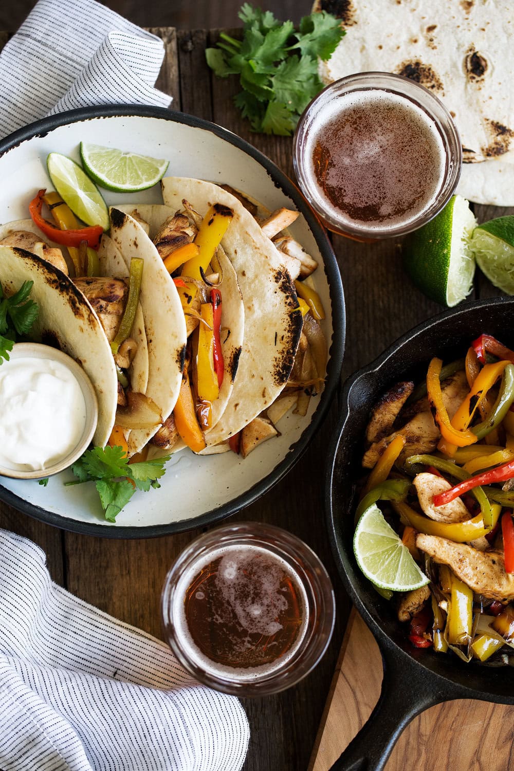 Tequila lime chicken fajitas cooking with cocktail rings overhead