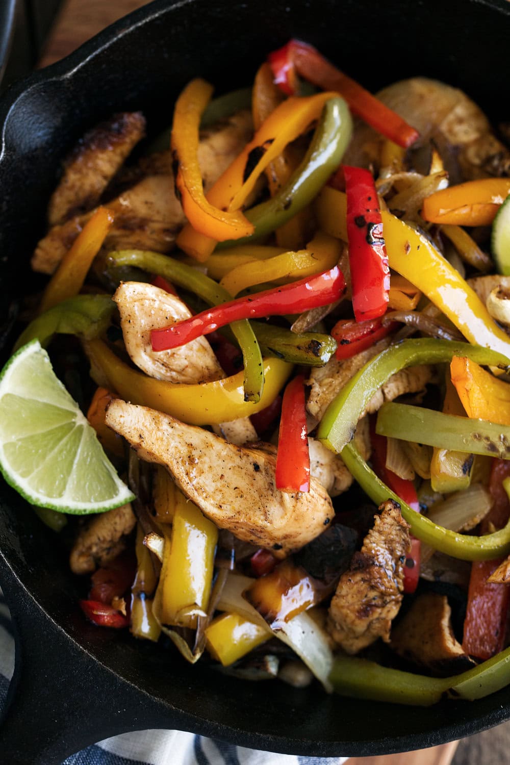 Tequila lime chicken fajitas cooking with cocktail rings