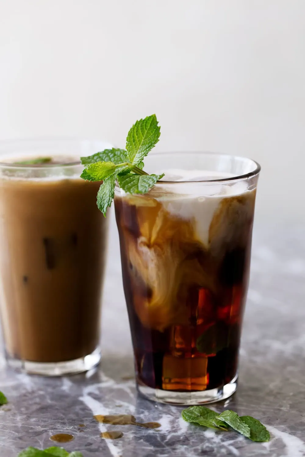 mint mojito iced coffee with cream and mint garnish
