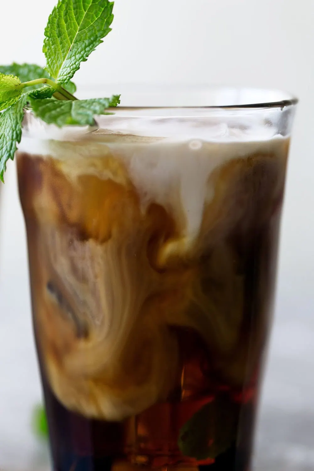 mint mojito iced coffee cooking with cocktail rings closeup