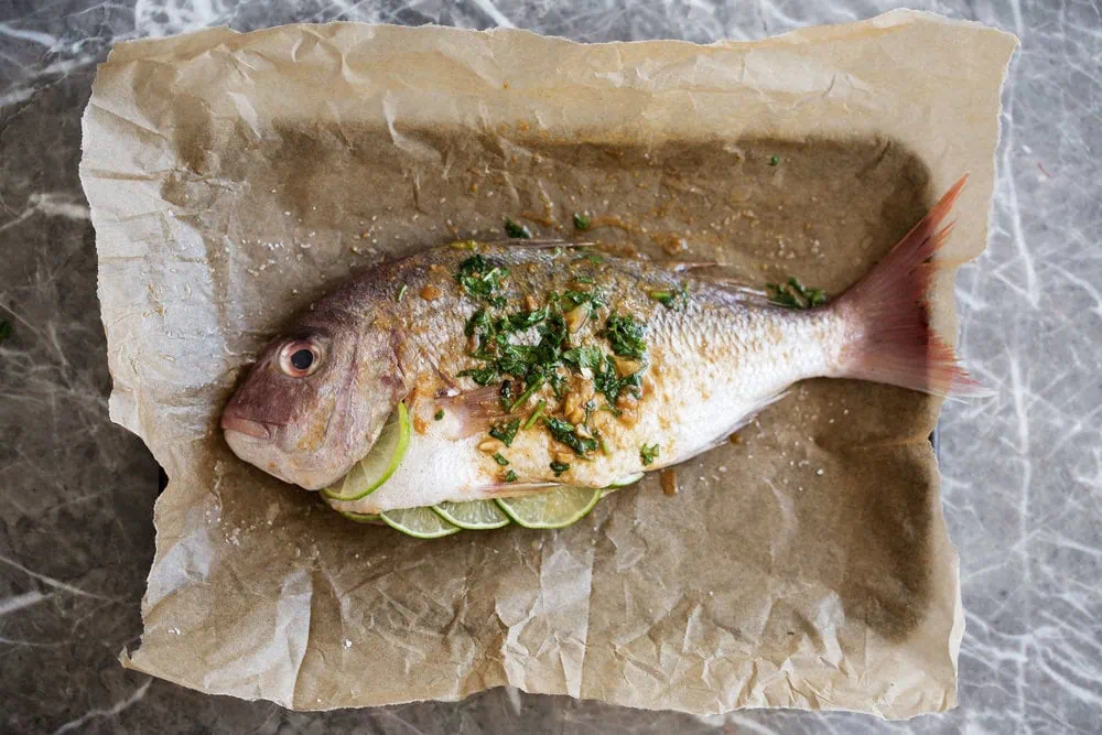 red snapper with asian spices ready for roasting in oven