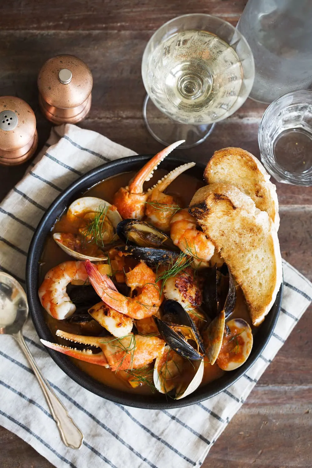 San Francisco cioppino seafood stew with mussels shrimp crab claws and scallops in tomato based broth