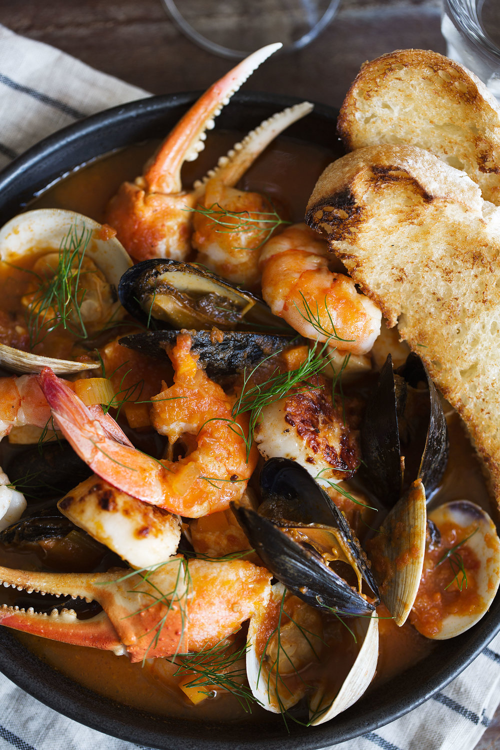 classic San Francisco stew recipe, cioppino, is filled with scallops, shrimp, halibut, swordfish, mussels, clams and snow crab claws.
