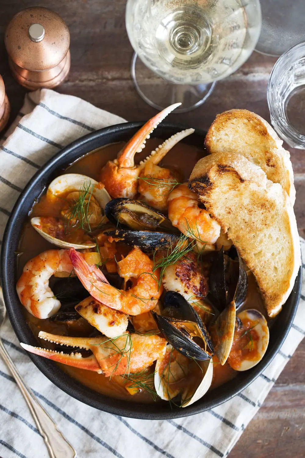 cioppino with sourdough bread and white wine