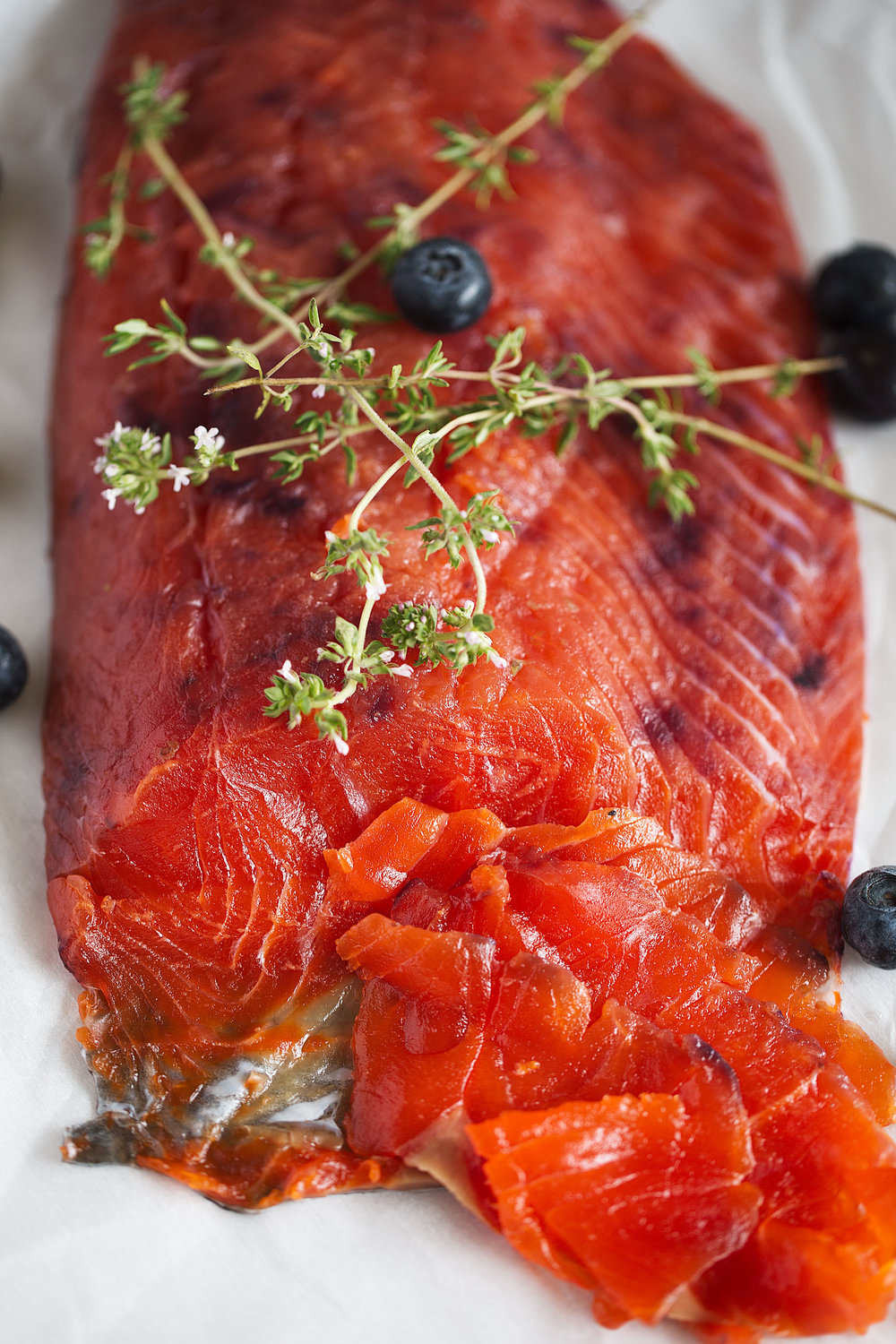 closeup blueberry-cured salmon gravlax sliced