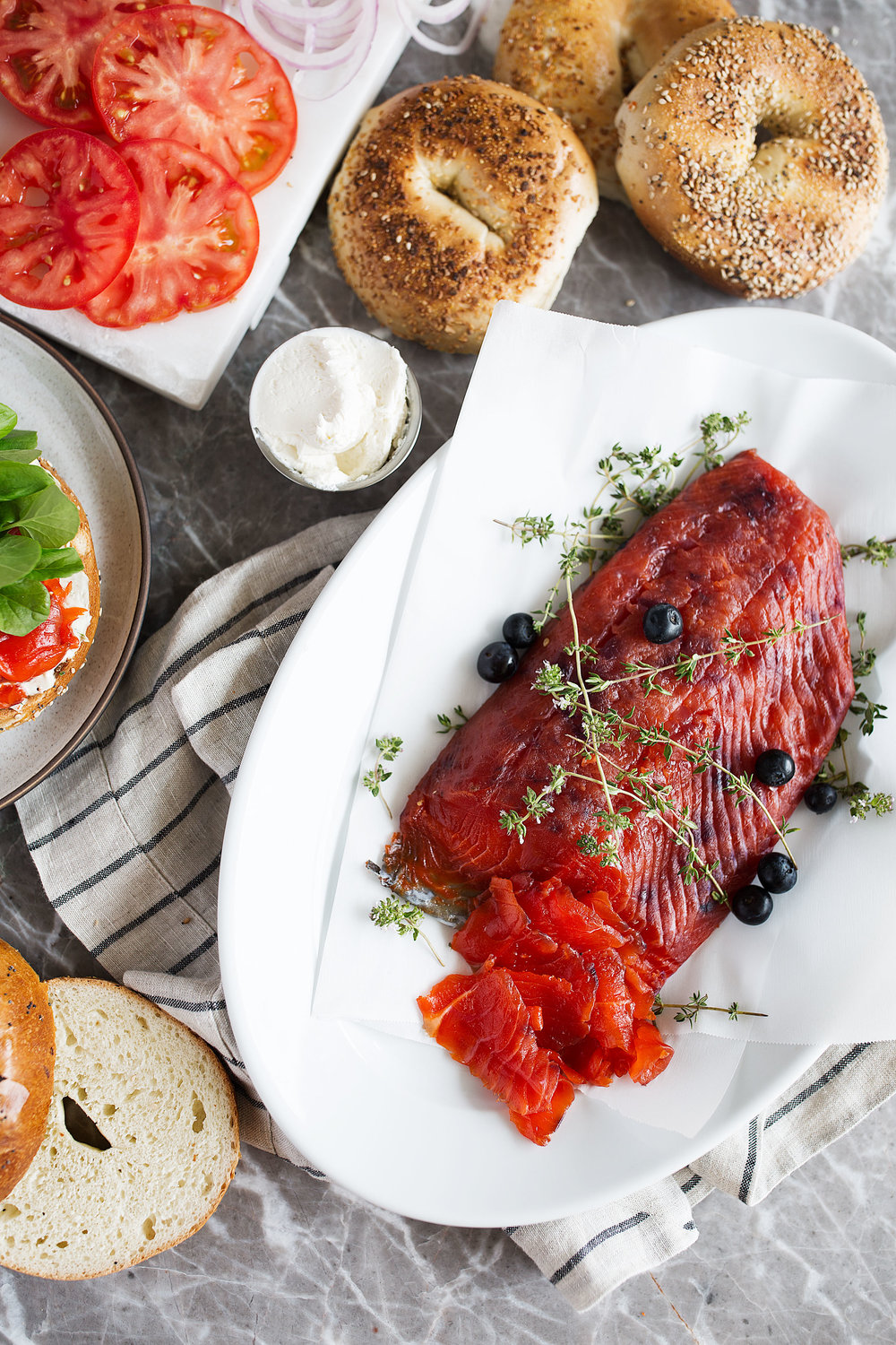 blueberry cured salmon gravlax with bagels and cream cheese