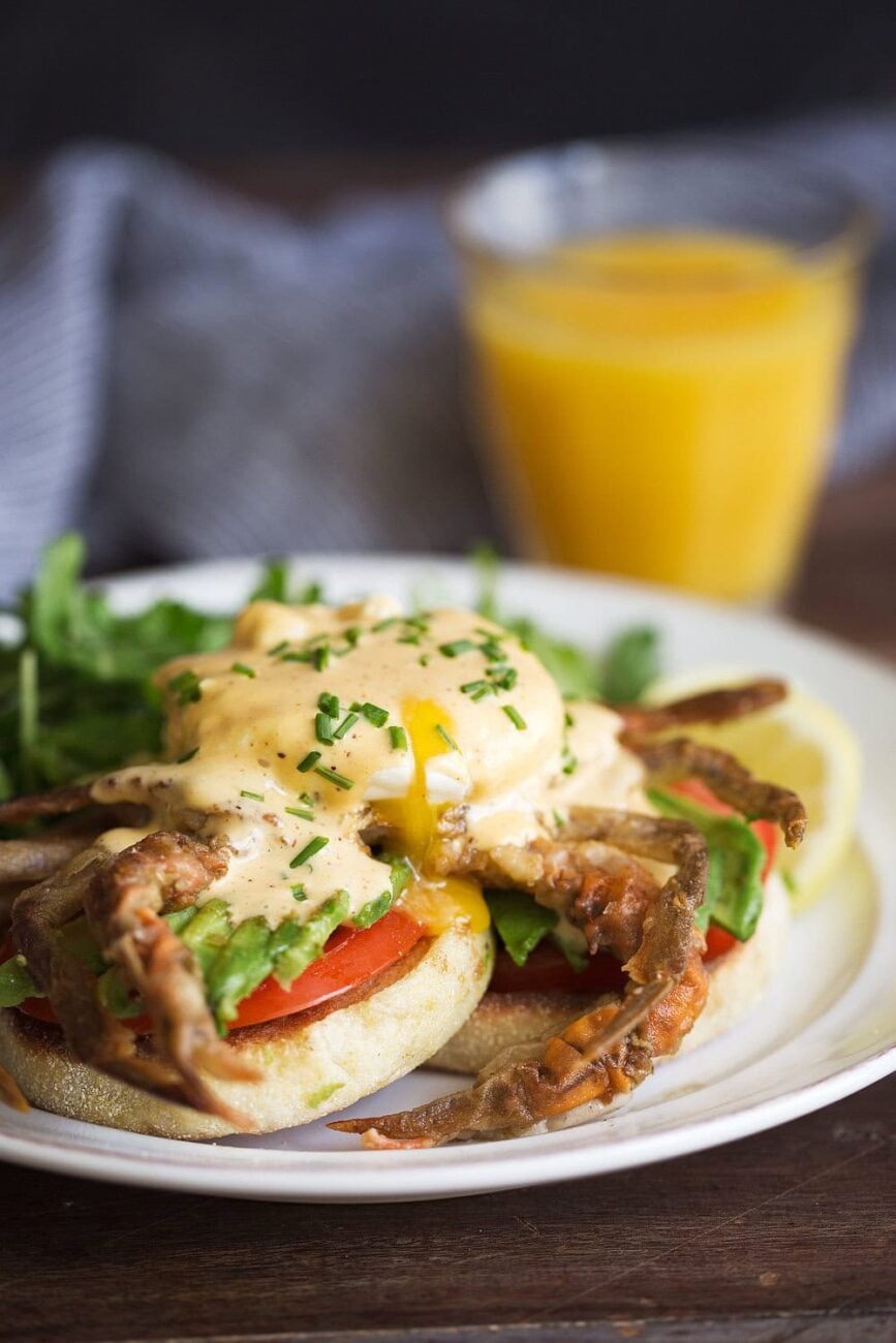 soft-shell crab eggs benedict with cajun hollandaise and egg yolk drip.