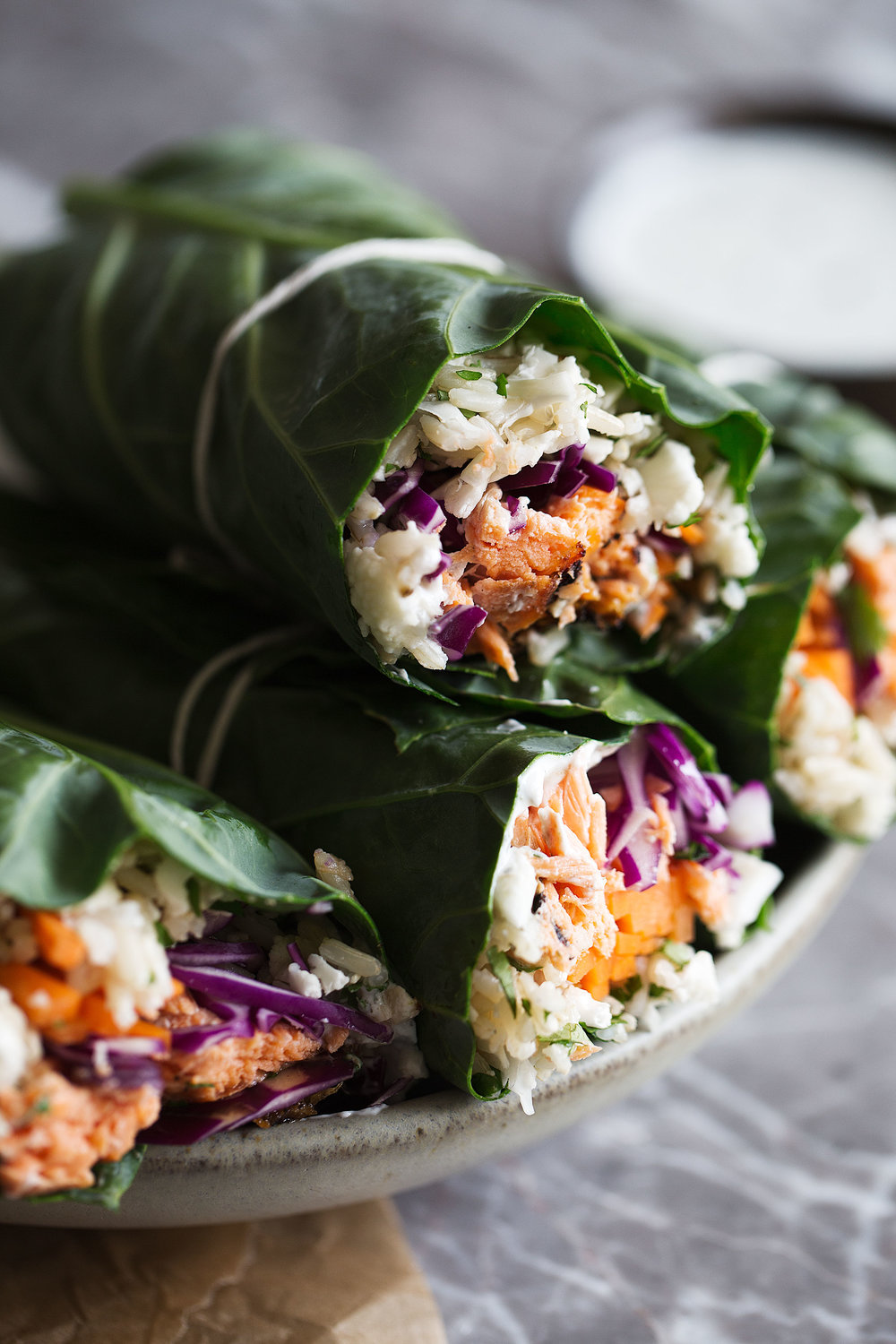 closeup Grilled BBQ Salmon and Veggie Collard Green Wraps with Ranch Yogurt Sauce