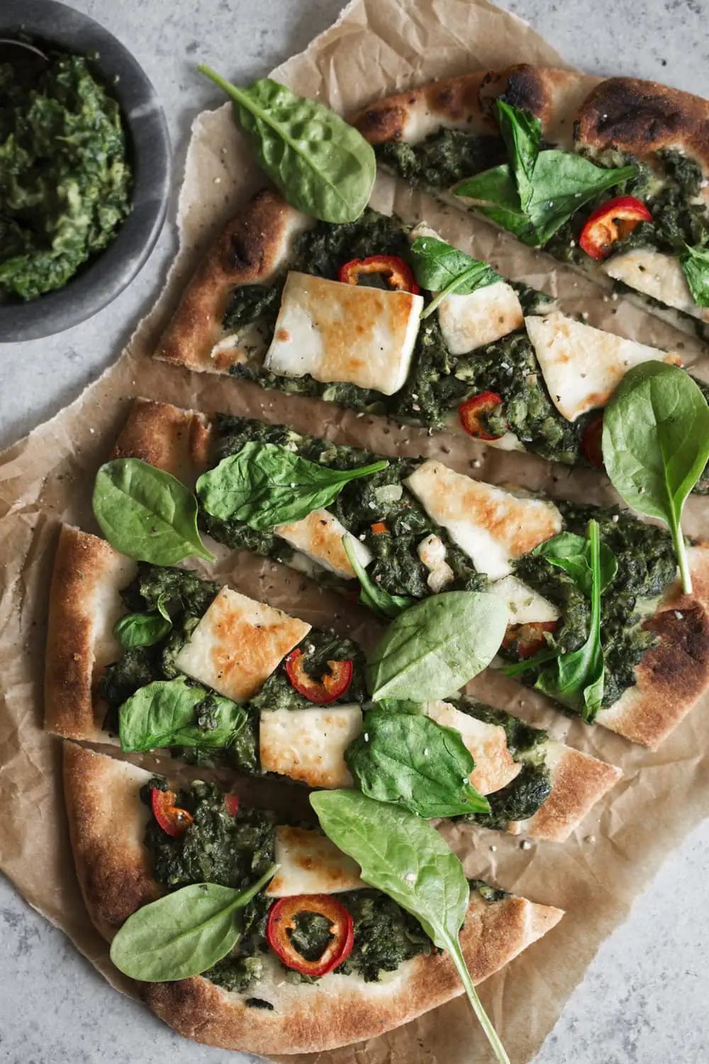 closeup saag paneer naan pizza