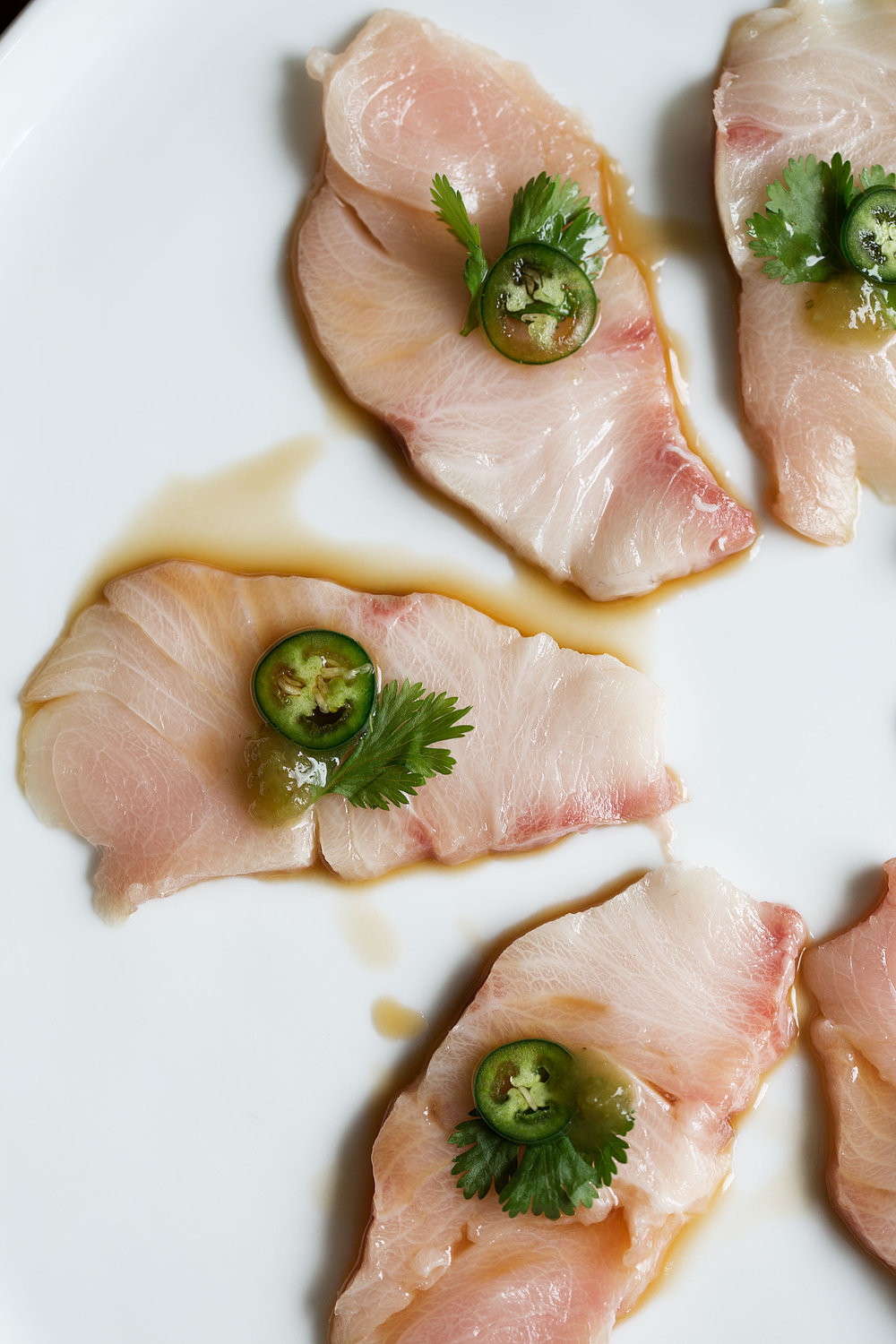 closeup shot of thinly sliced yellowtail hamachi sashimi recipe