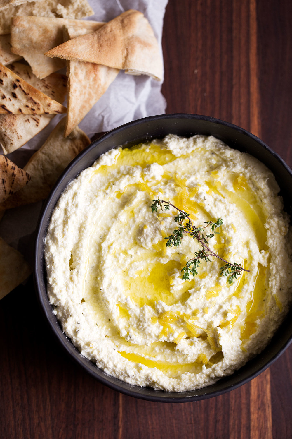 closeup whipped feta dip recipe with thyme and lemon zest garnish