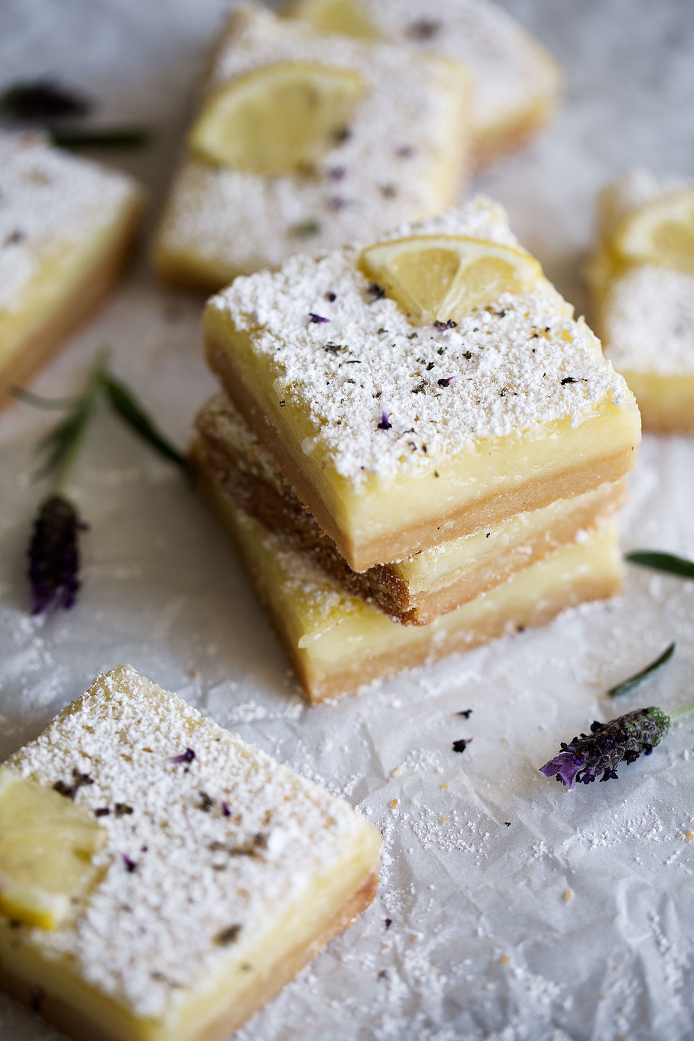 lemon lavender squares stacked garnished with lemon slice