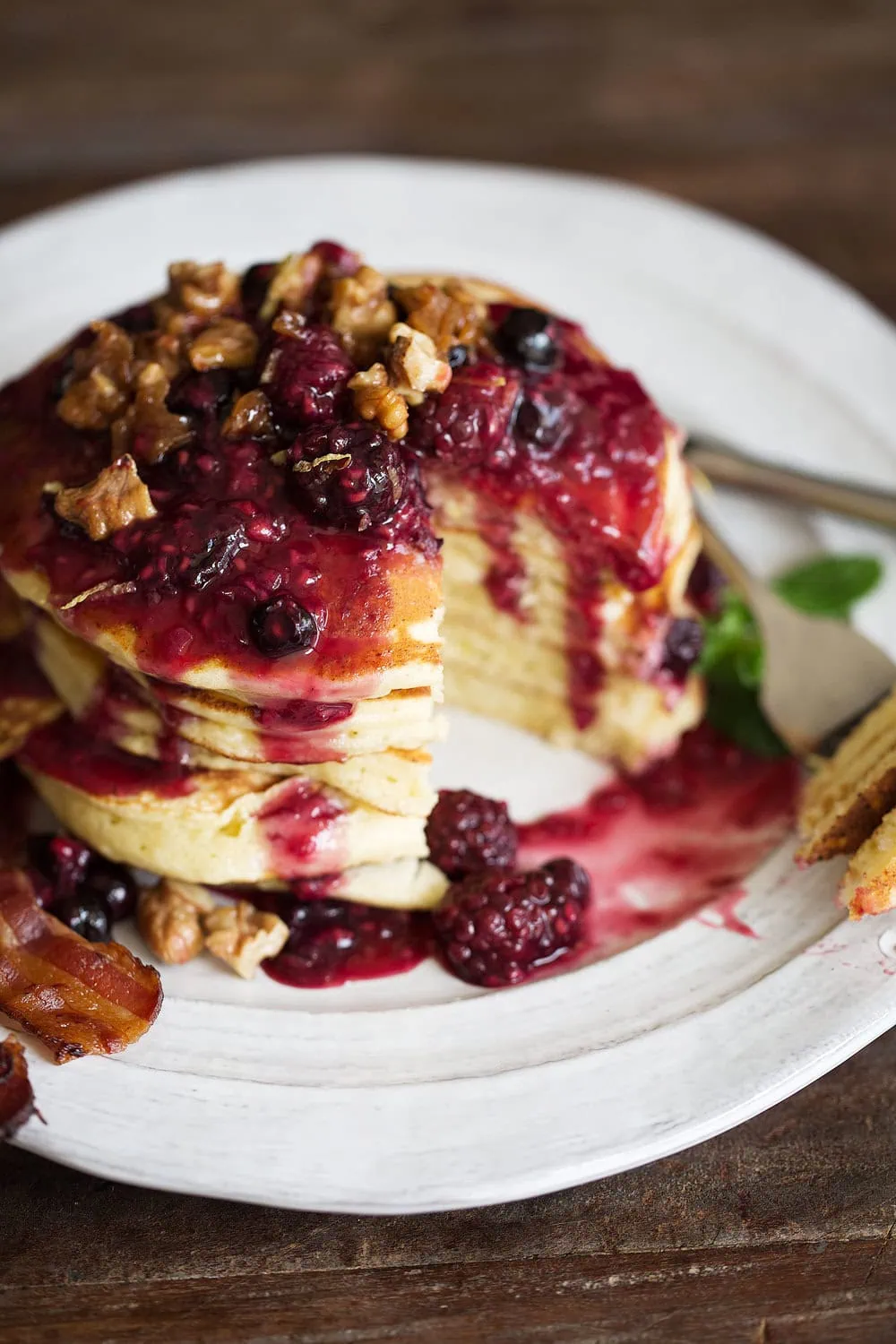lemon ricotta pancakes with mixed berry compote and candied walnuts cut