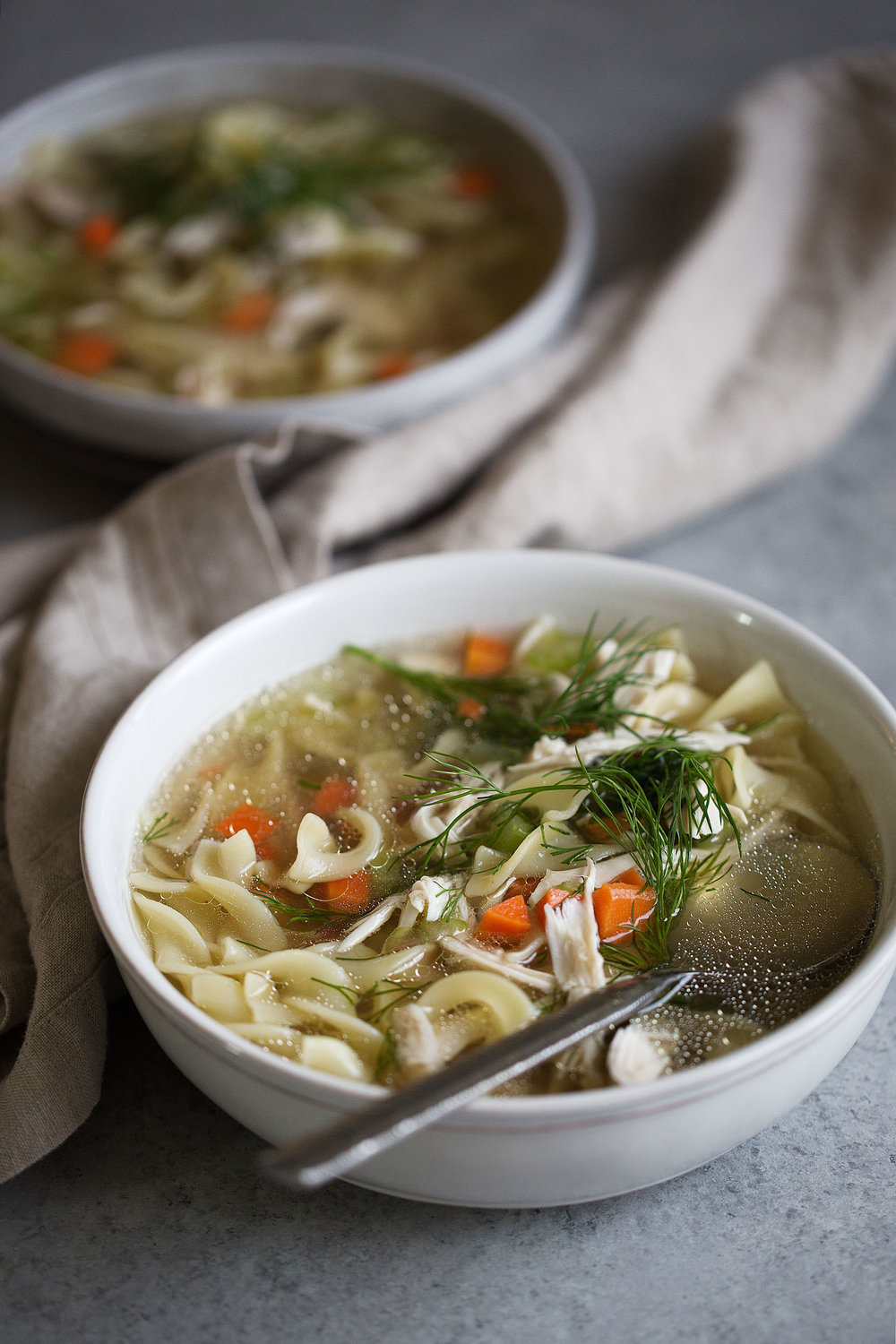 old-school chicken noodle soup with dill garnish