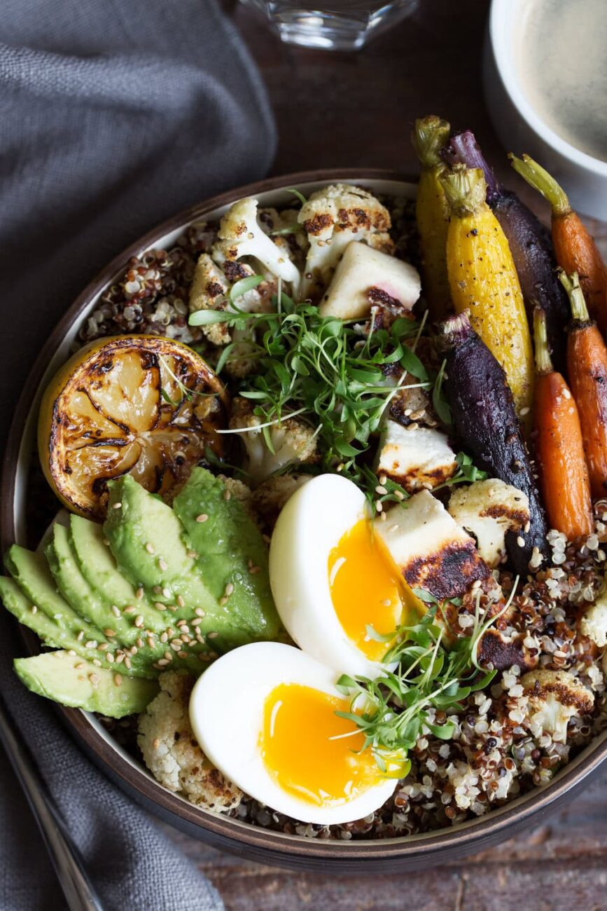 grain bowl with halloumi, quinoa, soft-boiled egg, roasted carrots and cauliflower.
