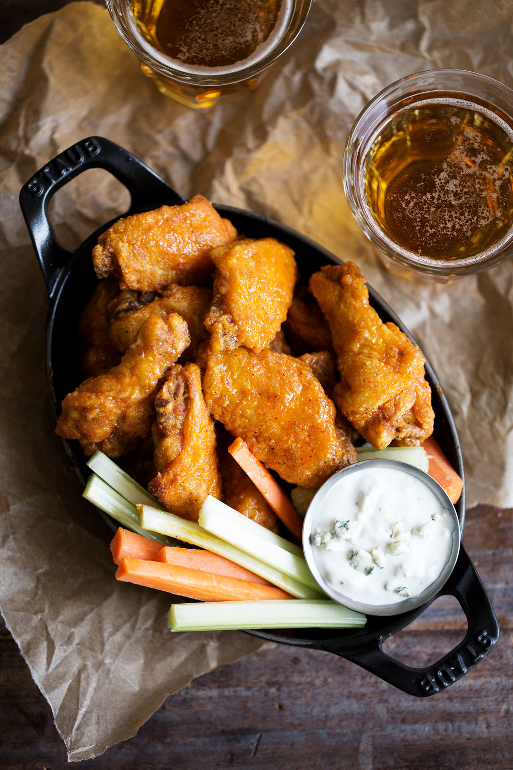 fried chicken wings in buffalo sauce with homemade blue cheese carrots and celery