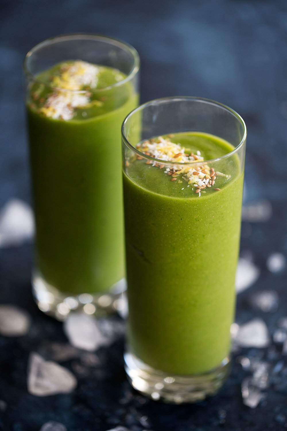 tropical green smoothie garnished with shredded coconut