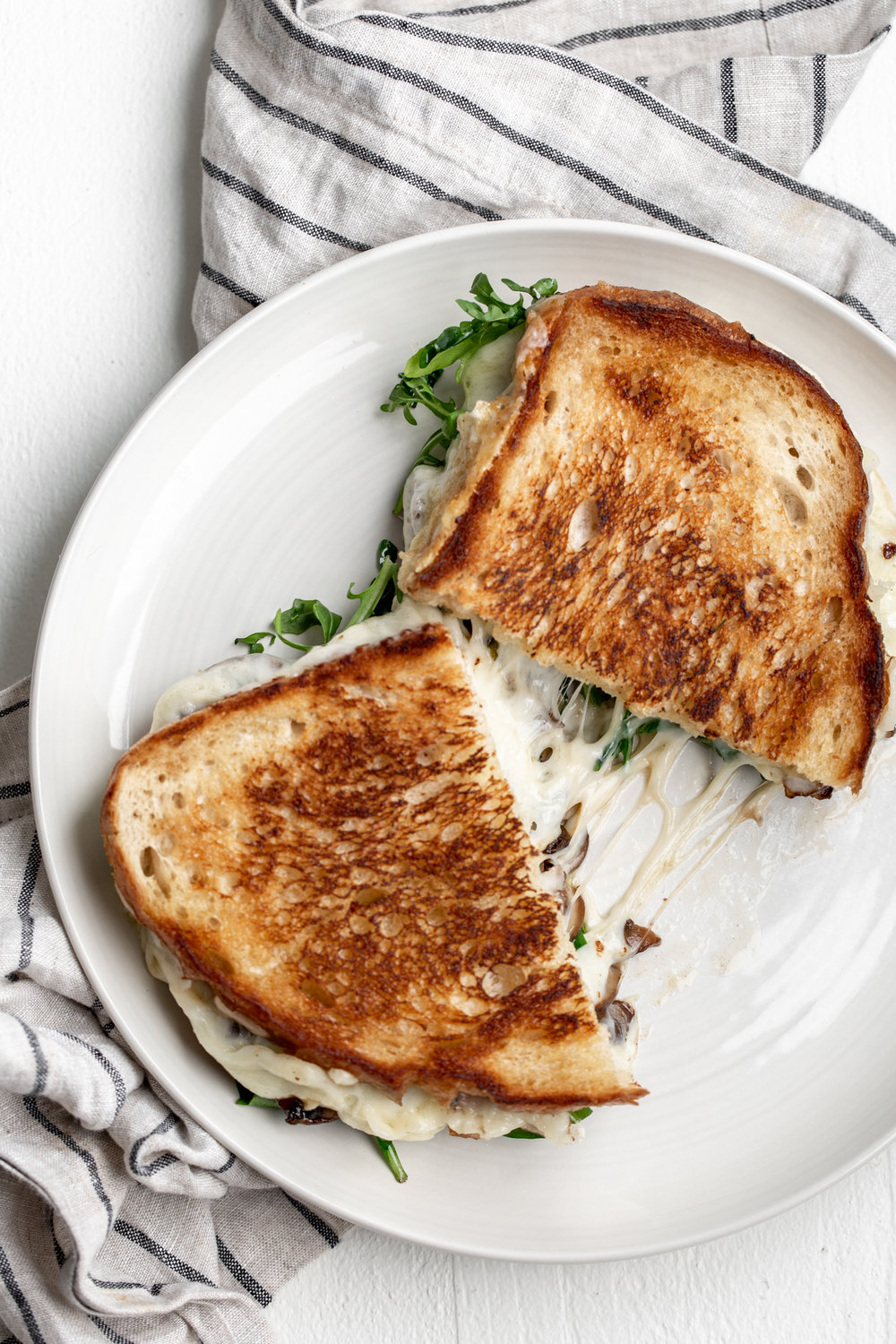 truffle grilled cheese with mushrooms and arugula recipe cheese pull