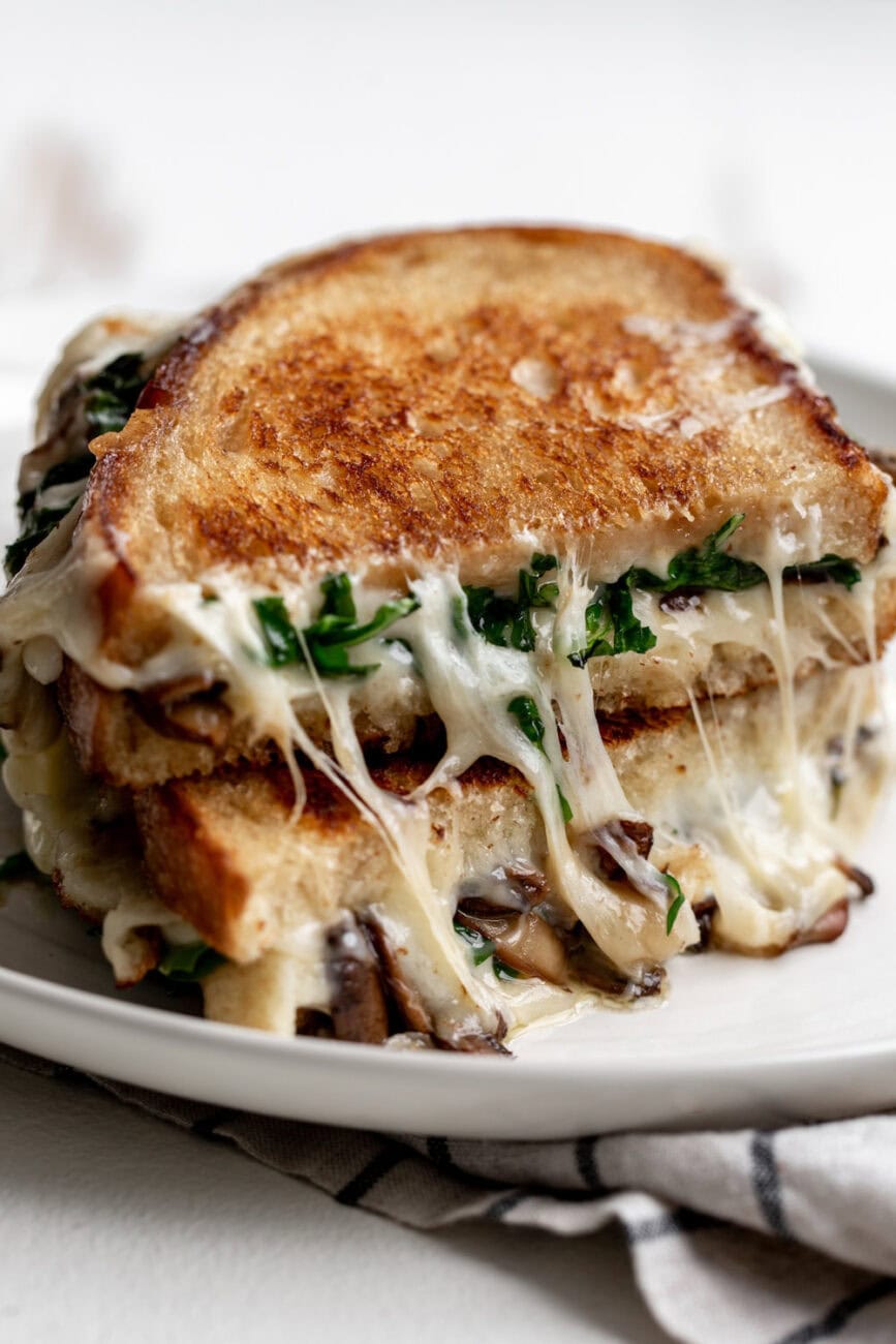 truffle grilled cheese stacked with mushrooms and arugula.