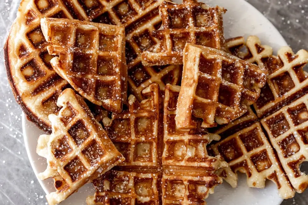yeasty overnight waffles cut into triangles