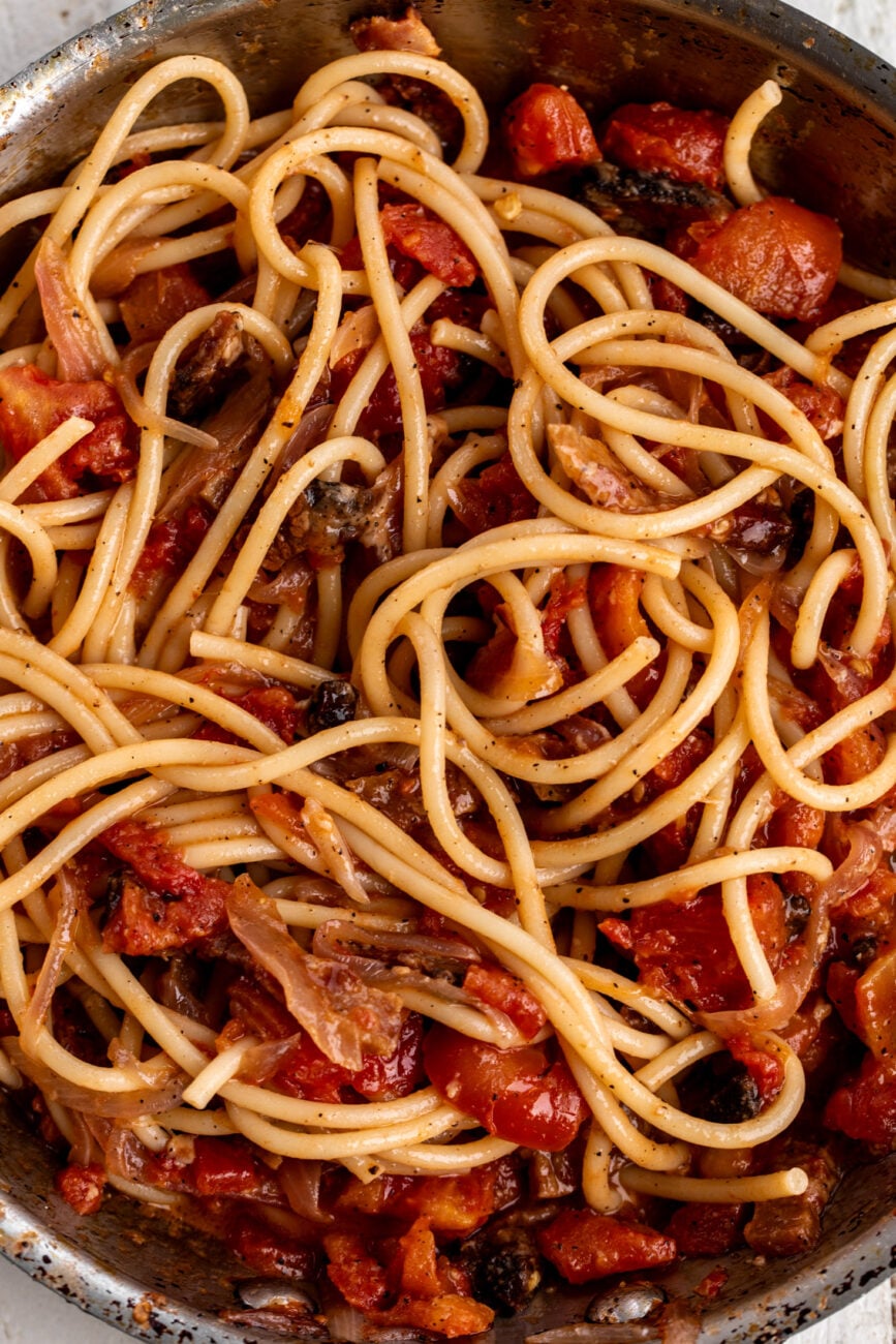guanciale, chopped peeled tomatoes and onions tossed with cooked bucatini.