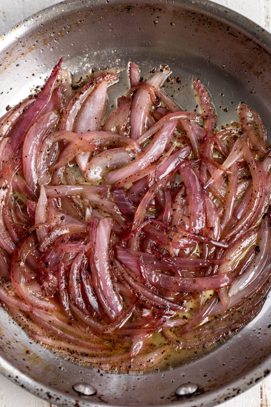 sautéed sliced red onions in rendered pork fat.