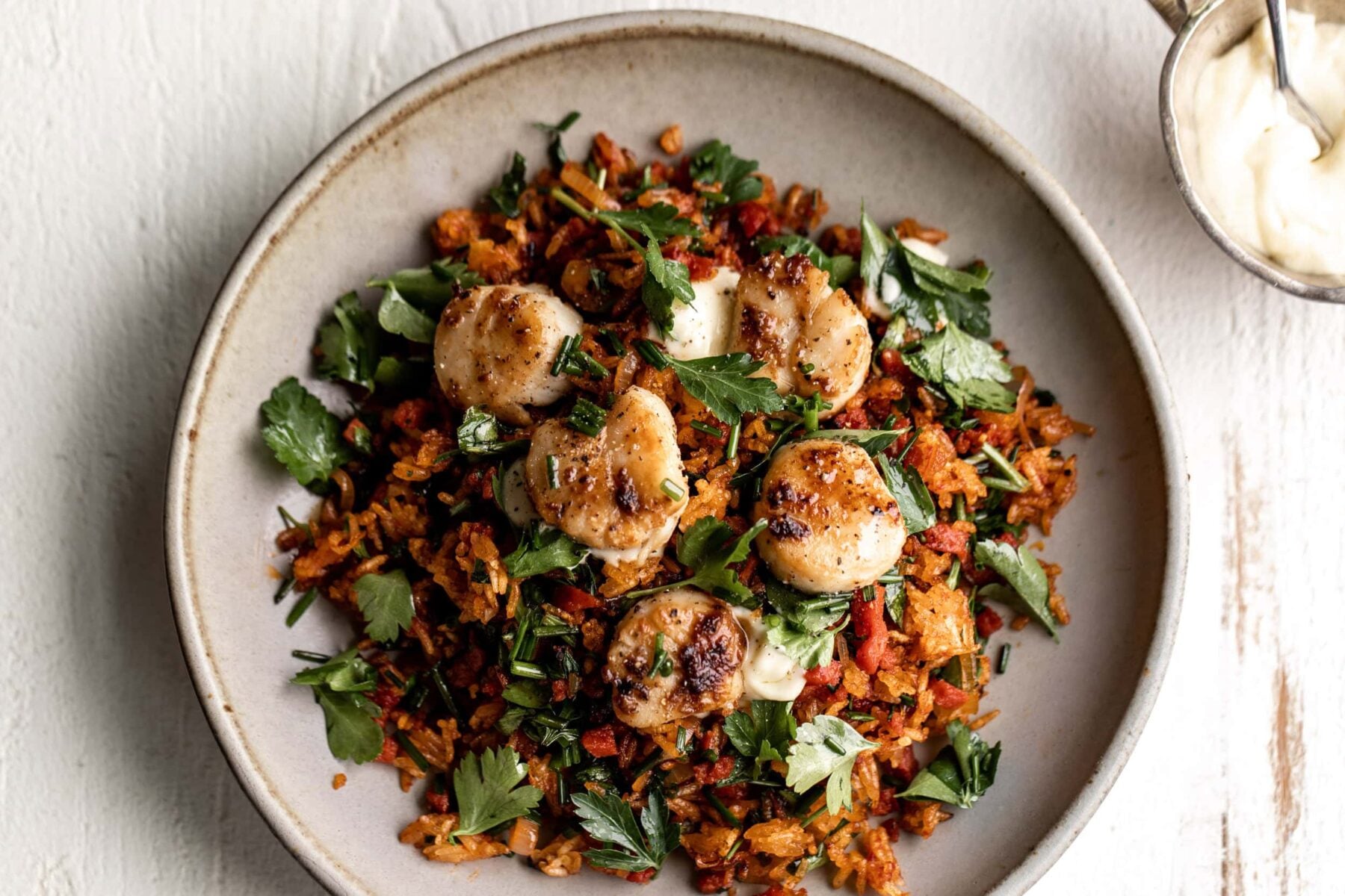 pepperoni fried rice with herbs scallops and aioli.