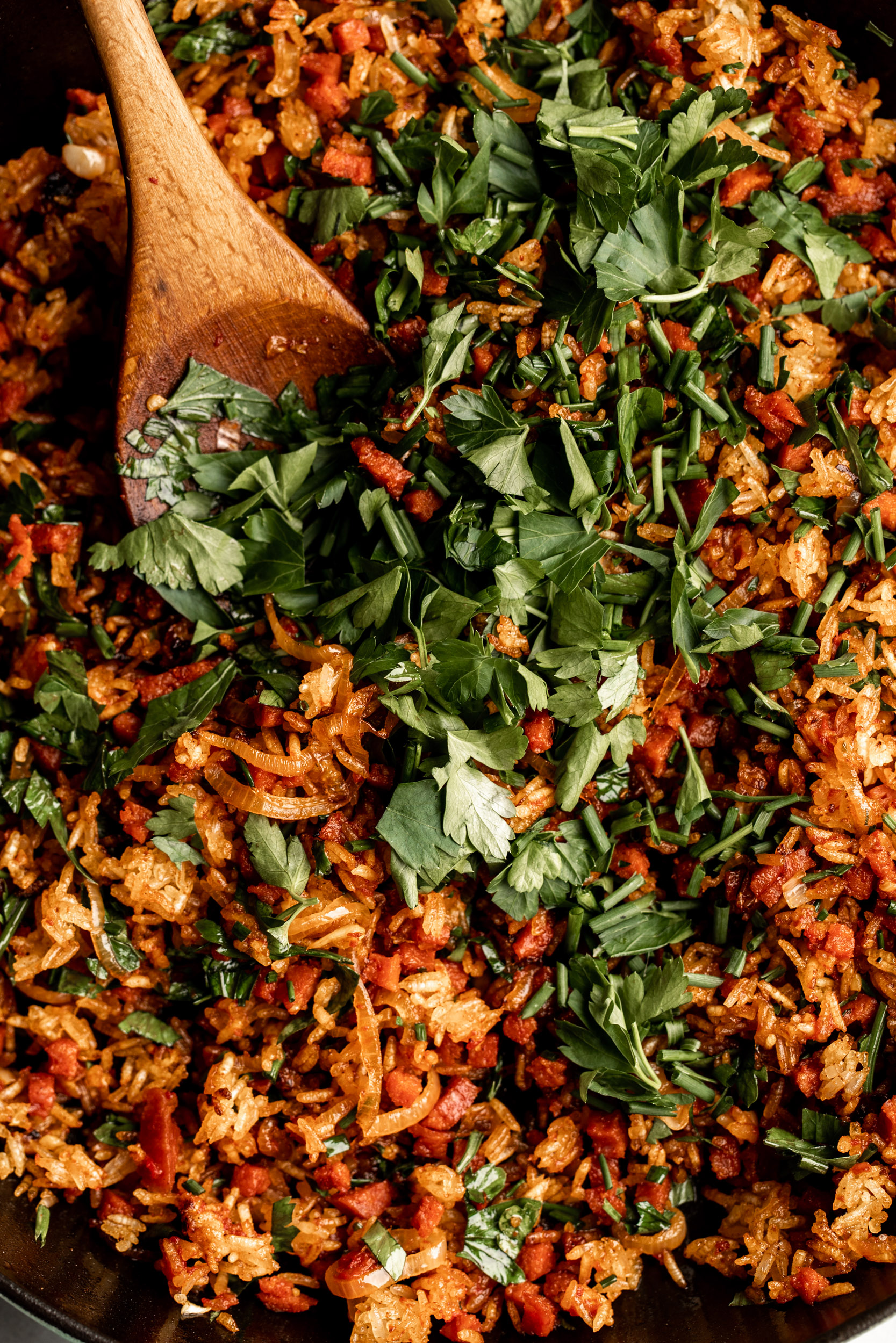 crispy pepperoni fried rice with diced parsley and chives