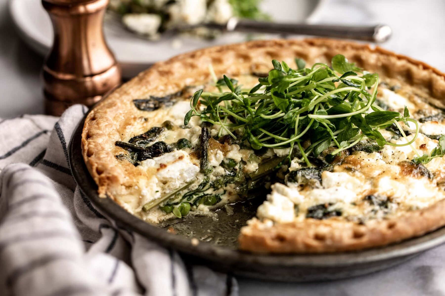 spring vegetable quiche with pea shoots.