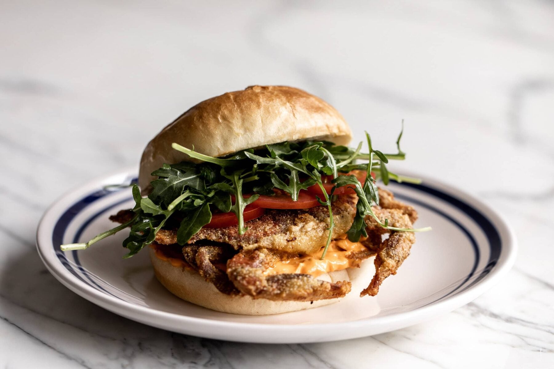 soft shell crab sandwich with Calabrian chili aioli.