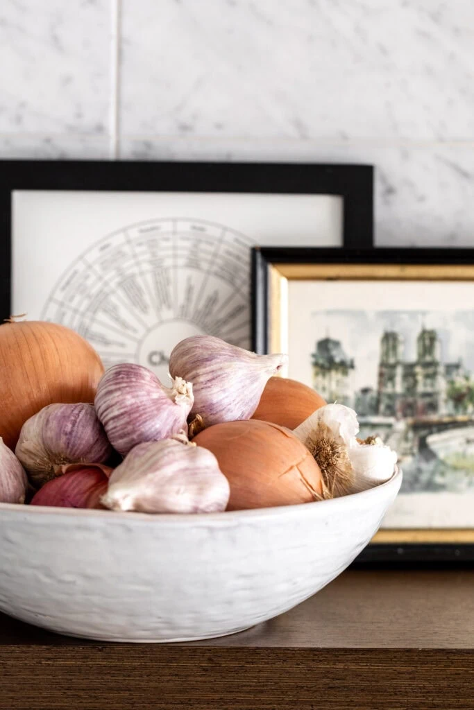 stone bowl of garlic shallots and onion