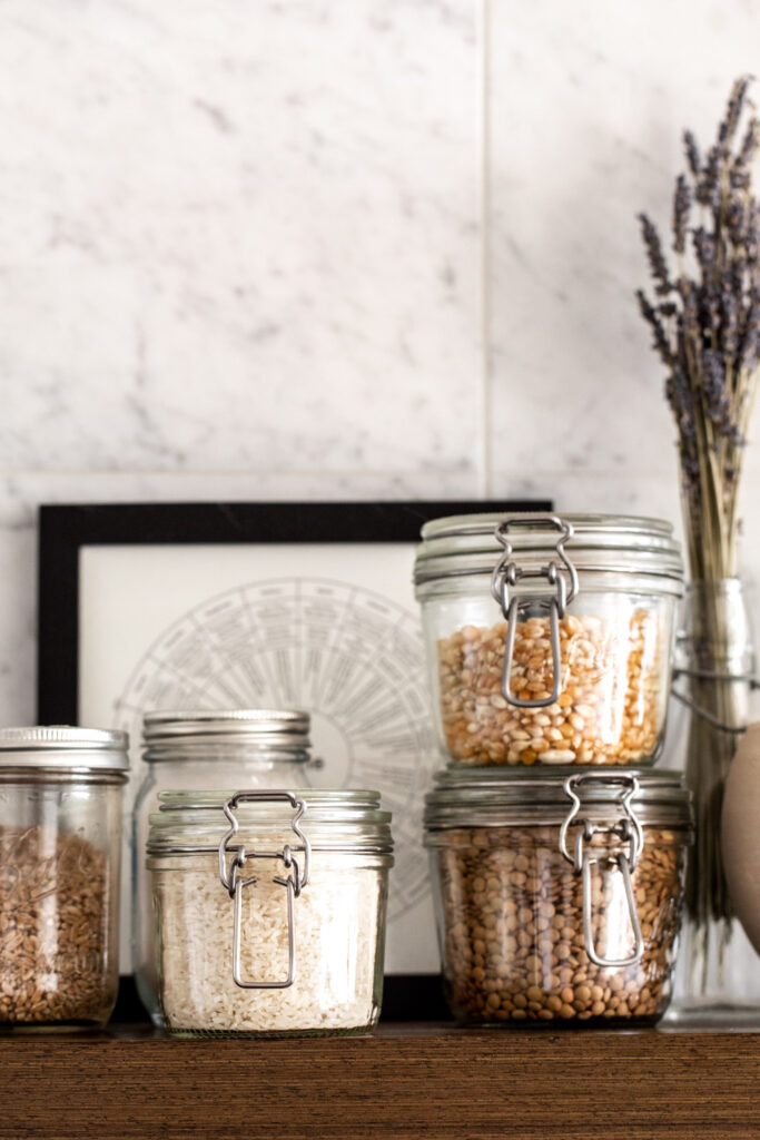 My Guide to a Fully Stocked Kitchen pantry staples glass jars of grains rice and lentils