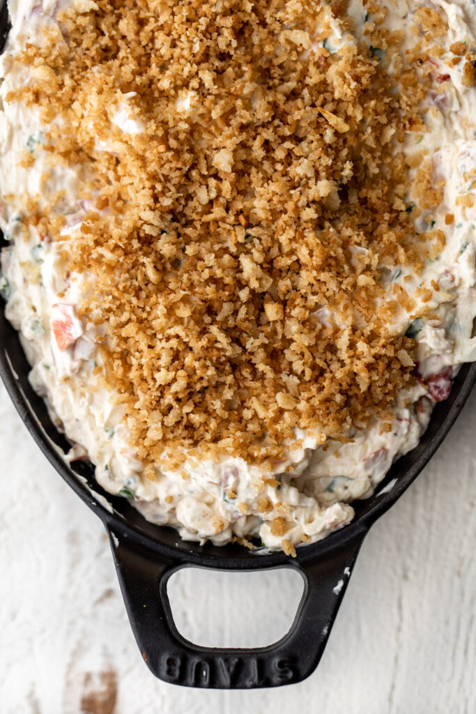 lobster dip spread in serving dish topped with breadcrumbs