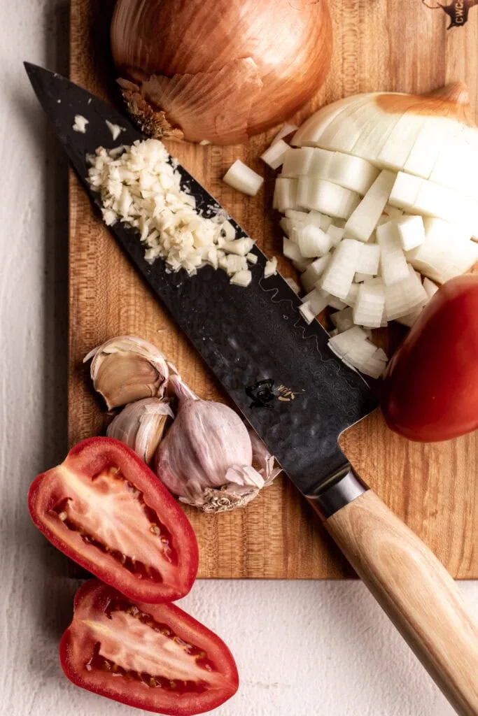tomato and onion for Creamy Tomato & Bacon Pasta