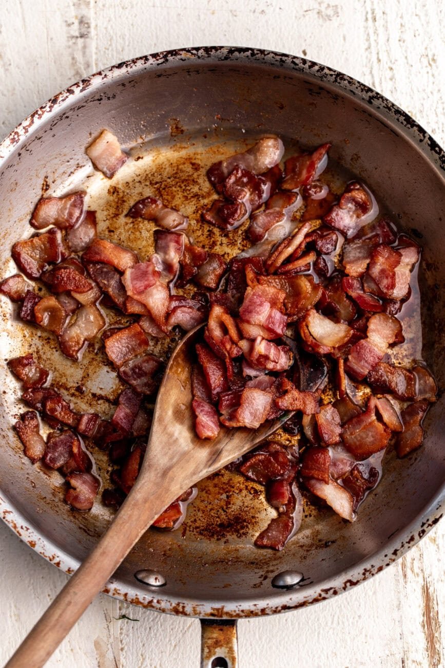 diced sautéed crispy bacon cooked in pan.