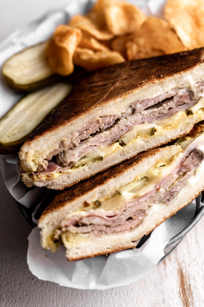 cuban sandwich with roast pork, ham, swiss cheese and pickles
