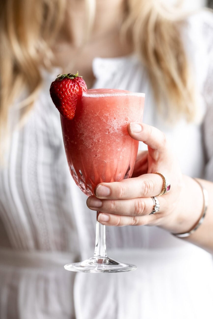 Glass of Frosé being held.