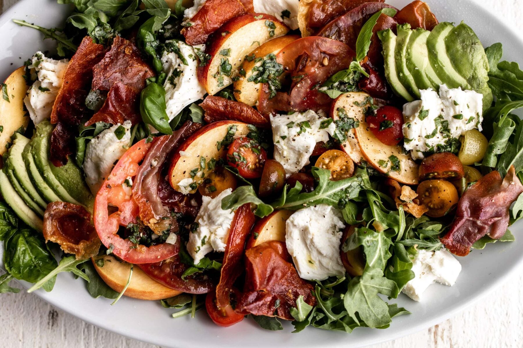 crispy prosciutto with peaches, tomatoes, mozzarella and arugula with basil vinaigrette.