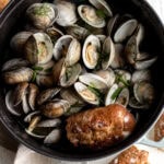 beer steamed clams in large staub with bread