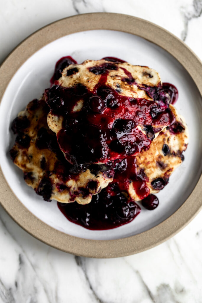 This blueberry pancake recipe is made with buttermilk for extra fluffy pancakes topped with a blueberry ginger compote. 