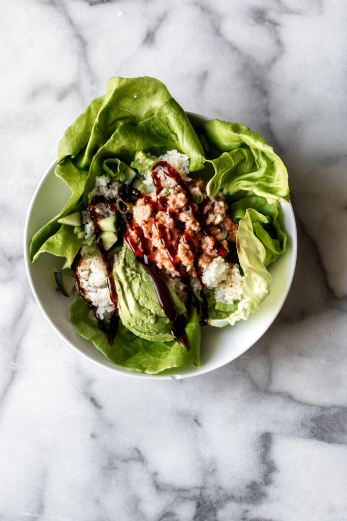 deconstructed crispy rice spicy tuna bowl as a butter lettuce salad