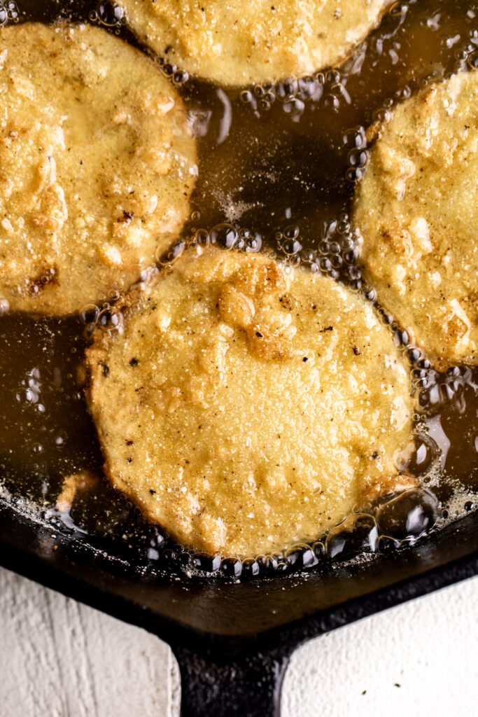 sliced green tomatoes in buttermilk and cornmeal batter fried until golden brown