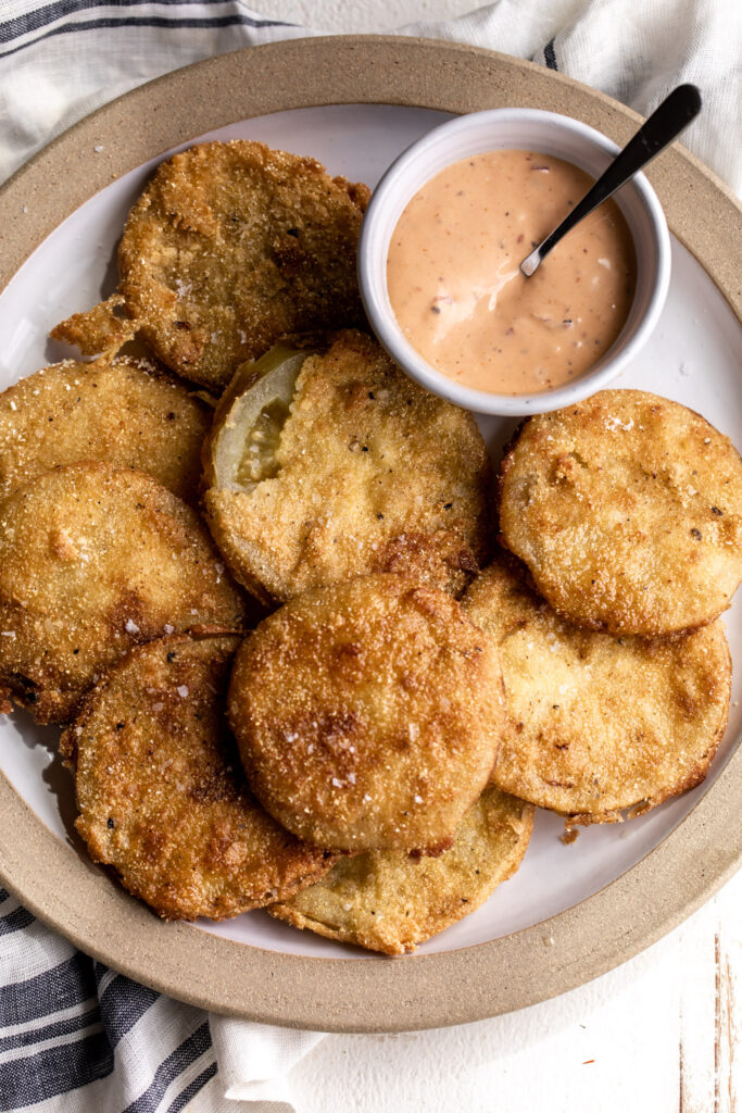 Slices of green tomato tossed in buttermilk and fried in a flour and cornmeal batter served paired with the Southern “comeback sauce”. 