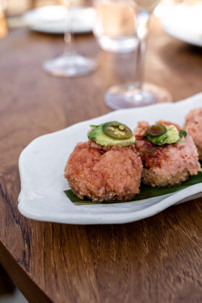 crispy rice with spicy tuna nobu malibu topped with avocado and jalapeño slices 