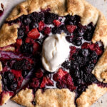 mixed berry galette with raspberries strawberries blueberries and blackberries in pastry dough