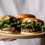 New Zealand Lamb Burgers with Curry Mayonnaise on a serving platter