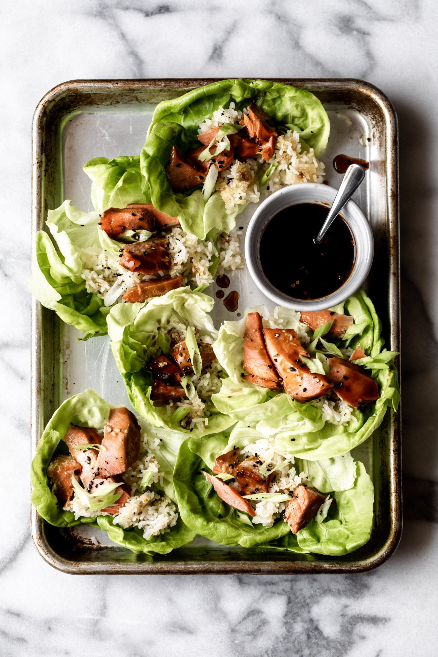 sweet and spicy teriyaki salmon lettuce wraps.