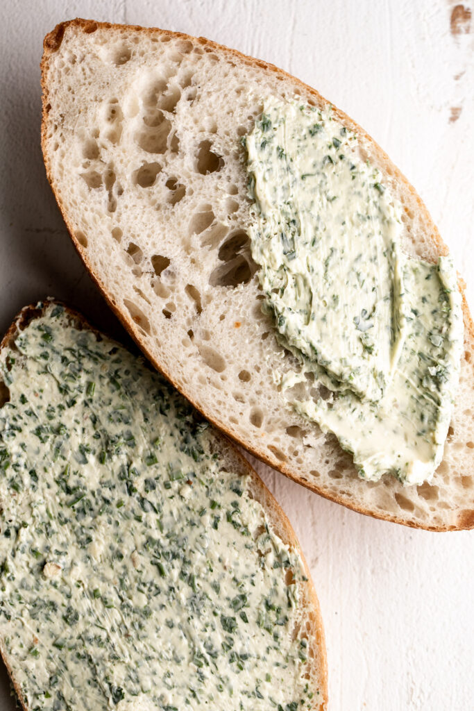 garlic herb butter spread on bread loaf