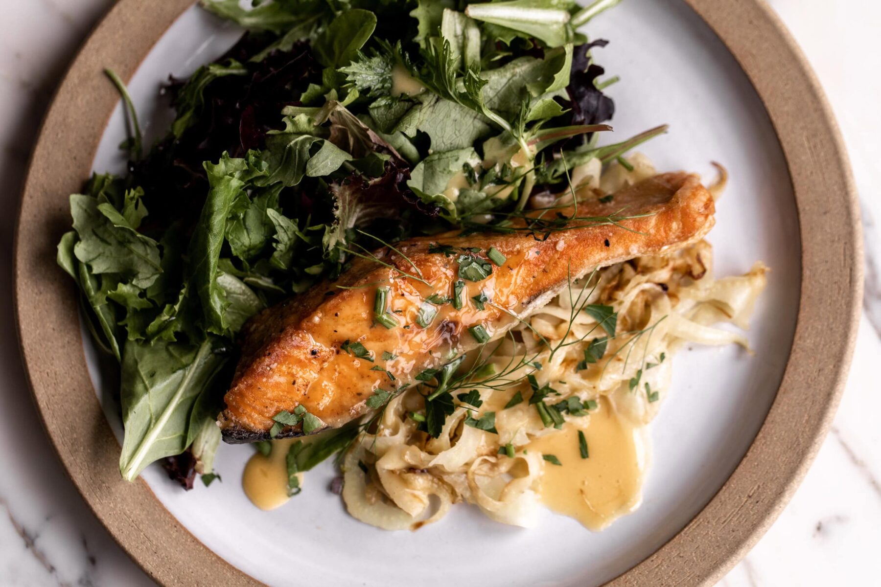 Crispy Salmon with Beurre Blanc and Sautéed Fennel.